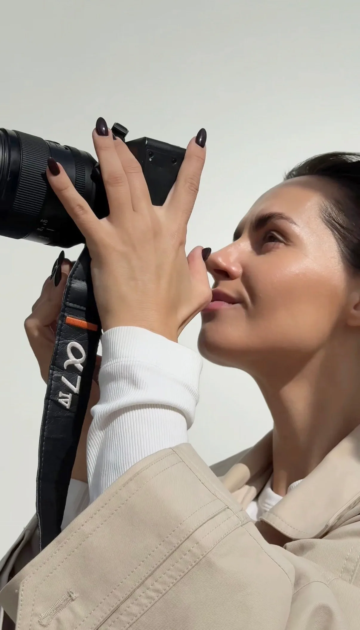 A photographer at work, camera in hand